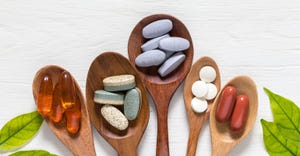 Vitamin pills in wooden spoons_1167230344.jpg