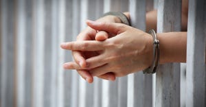 jail handcuffed hands.jpg