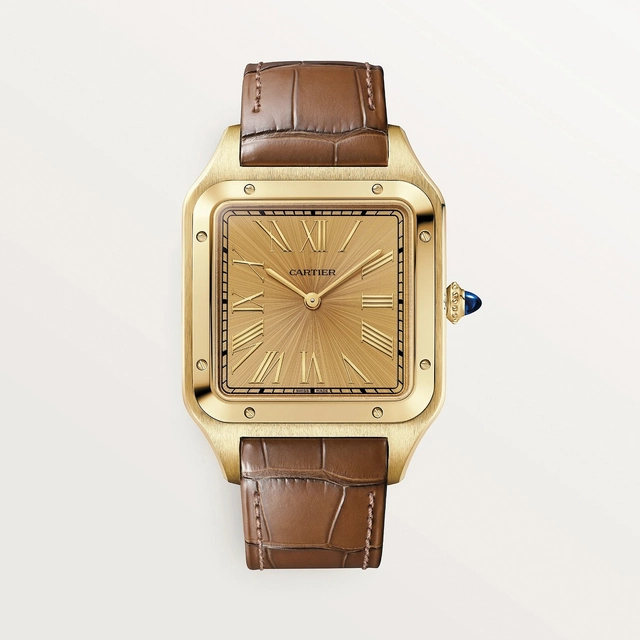 Cartier Santos-Dumont, XL Modell, mit Handaufzug, Kaliber 430 MC. Gehäuse aus 750er Gold, Zifferblatt mit Holzeffekt Cartier Santos-Dumont, XL Modell, mit Handaufzug, Kaliber 430 MC. Gehäuse aus 750er Gold, Zifferblatt mit Holzeffekt