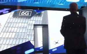 A visitor looks at a 6G logo at Mobile World Congress Barcelona A visitor looks at a 6G logo at Mobile World Congress Barcelona