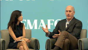 AT&T CEO John Stankey, right, speaks at a recent event.
