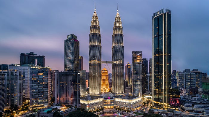Bright lights, big city: Axiata is headquartered in Kuala Lumpur, Malaysia. (Source: Esmonde Yong on Unsplash)