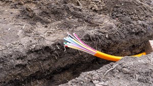 Fiber cable being installed underground.