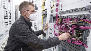 Technician working on the servers at Vodafone's 5G "standalone" site 
