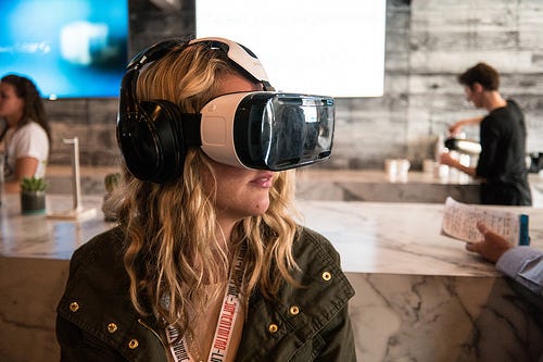 Applications like VR will put greater demands on the network, which CORD can help support. (Photo: Woman Using a Samsung VR Headset at SXSW, Nan Palermo, (CC BY 2.0))