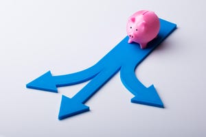 Elevated view of pink piggybank and and blue arrows showing multiple directions