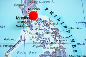 A red pushpin on a map of Philippines