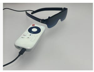 Evolution Digital portable set-top with built in remote control and attached viewing glasses