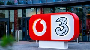 VodafoneThree sign outside office building VodafoneThree sign outside office building