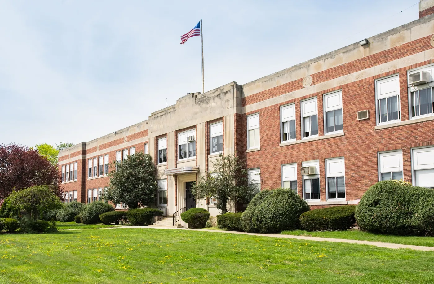 Exterior view of a typical American school building seen on a spring day Exterior view of a typical American school building seen on a spring day