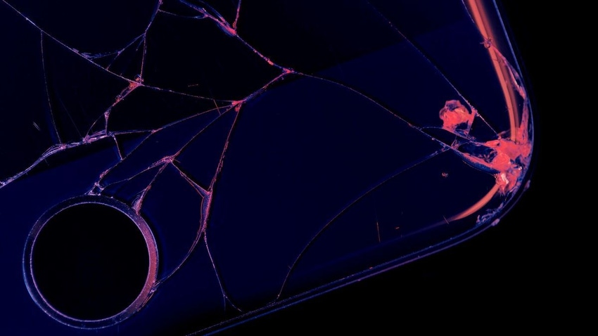Arty shot of a smartphone with a cracked screen