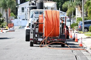 IRIVNE, CALIFORNIA - 09 SEPT 2025: Workers laying Fiber Optic Cable for Cityside Fiber in a residential community IRIVNE, CALIFORNIA - 09 SEPT 2025: Workers laying Fiber Optic Cable for Cityside Fiber in a residential community