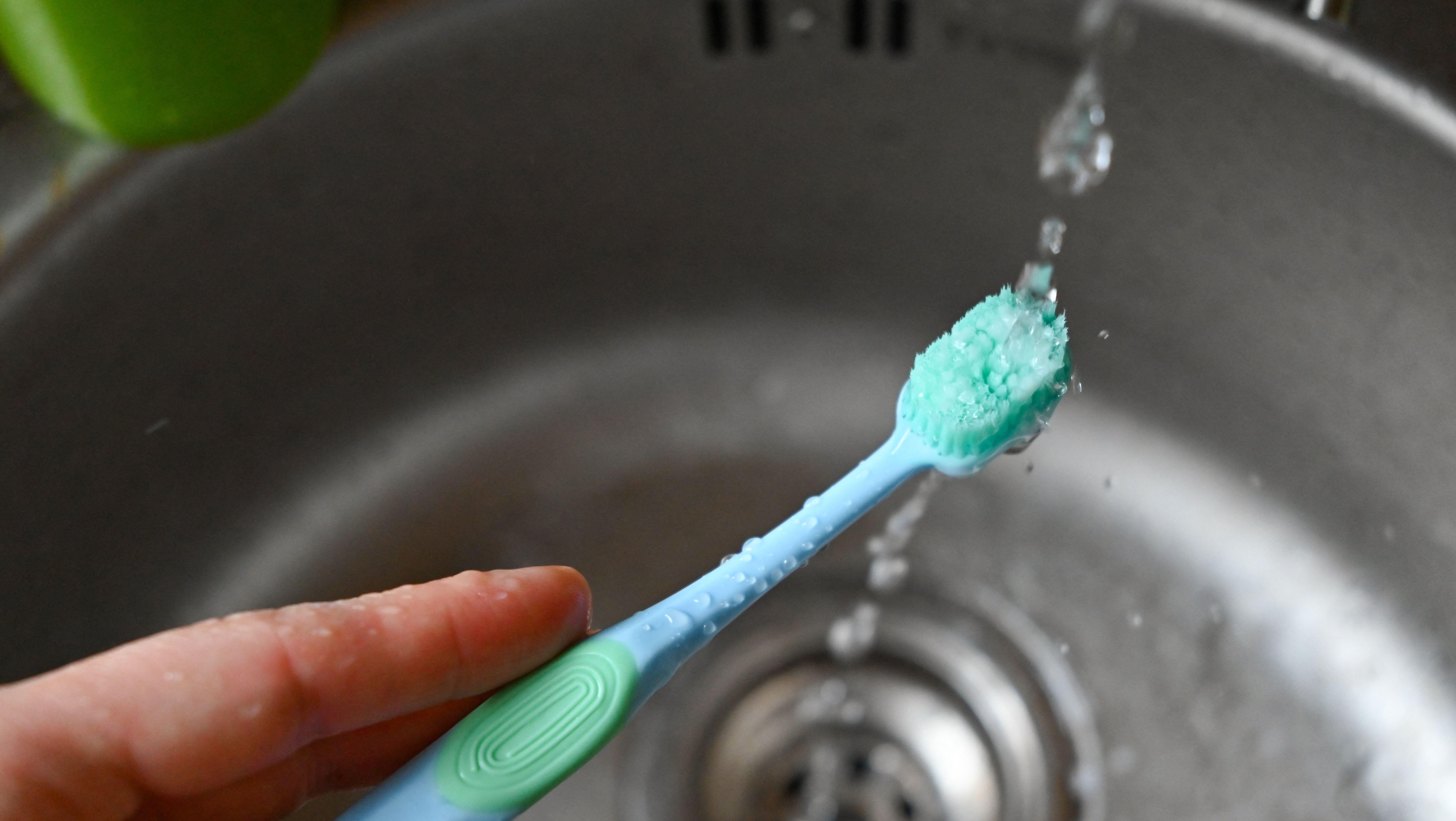 Water dripping onto a toothbrush