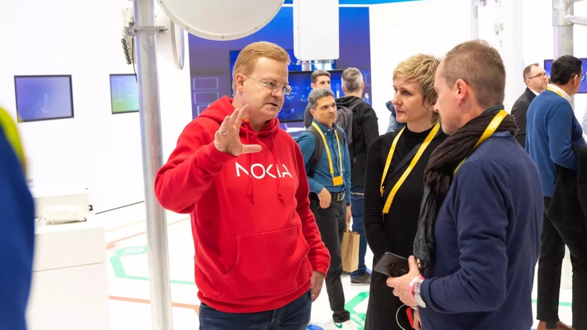 Nokia's Tommi Uitto talking to customers at MWC