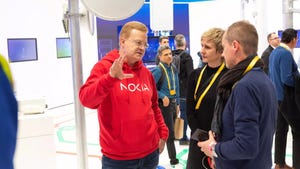 Nokia's Tommi Uitto talking to customers at MWC