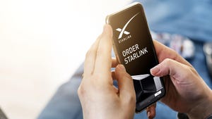 A smartphone with "Order Starlink" and the SpaceX Starlink logo on the screen