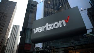 Verizon logo on a building with skyscrapers in the background.