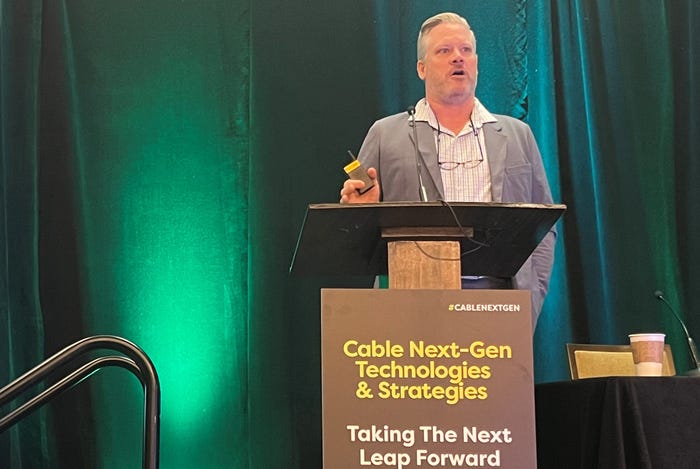 (Source: Jeff Baumgartner/Light Reading) CableLabs exec John Schnoor speaks at Cable Next-Gen (CNG) 2024 in Denver.