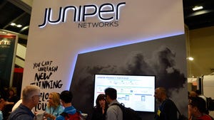 Juniper logo above attendees at an event