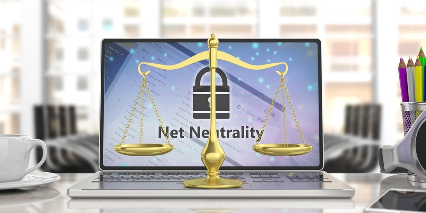 Net neutrality text on a computer screen and a golden law scales balance.