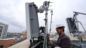 Technicians with radio kit on roof