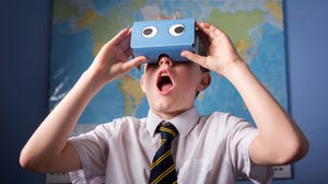 Schoolboy using virtual reality goggles