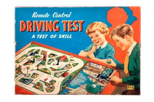 Children playing remote driving board game