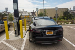 Tesla car at electric vehicle charging station in Brooklyn, NY