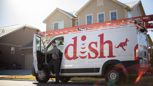 Dish van parked outside someone's home