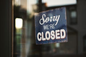 Sign on door that says Sorry We're Closed