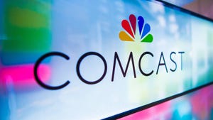 Comcast logo against colorful background