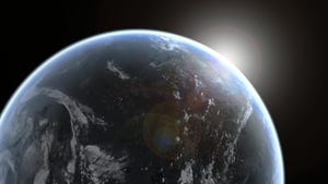 Sun emerging from behind planet Earth, as seen from space.