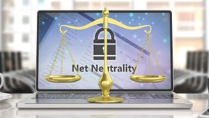Net neutrality text on a computer screen and a golden laws scales balance.