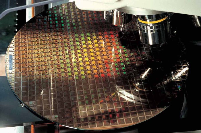 A silicon wafer being processed inside one of TSMC's fabs. (Source: TSMC)
