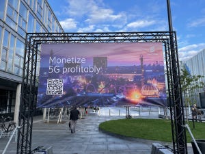 Billboard with QR code that says monetize 5G profitably