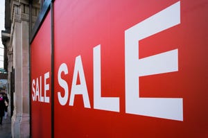 Sale signs in a store window, UK