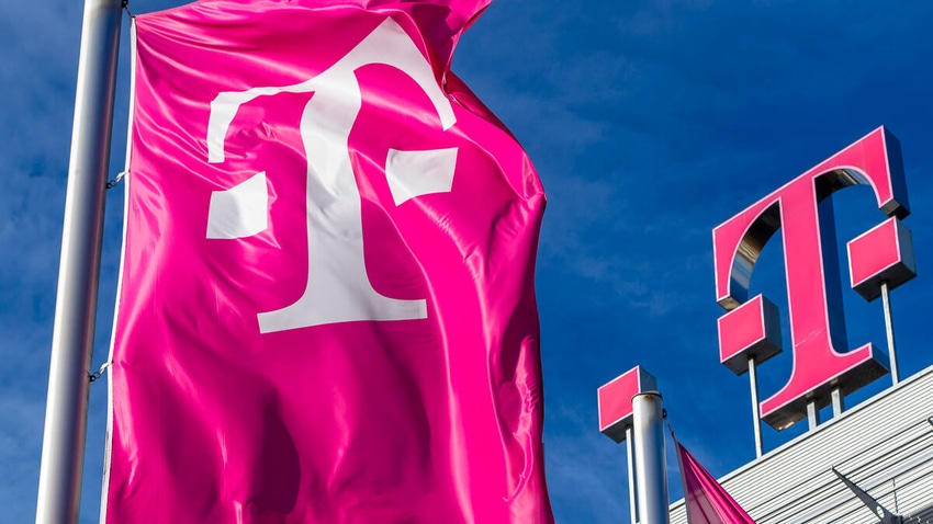 Deutsche Telekom logo on top of their building and flag with their logo to the left