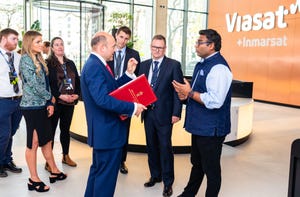 Viasat President Guru Gowrappan (right) in conversation with UK Minister of State for Science, Research and Innovation, Andrew Griffith (left).