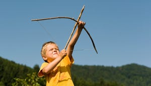 Boy about to fire an arrow into the air