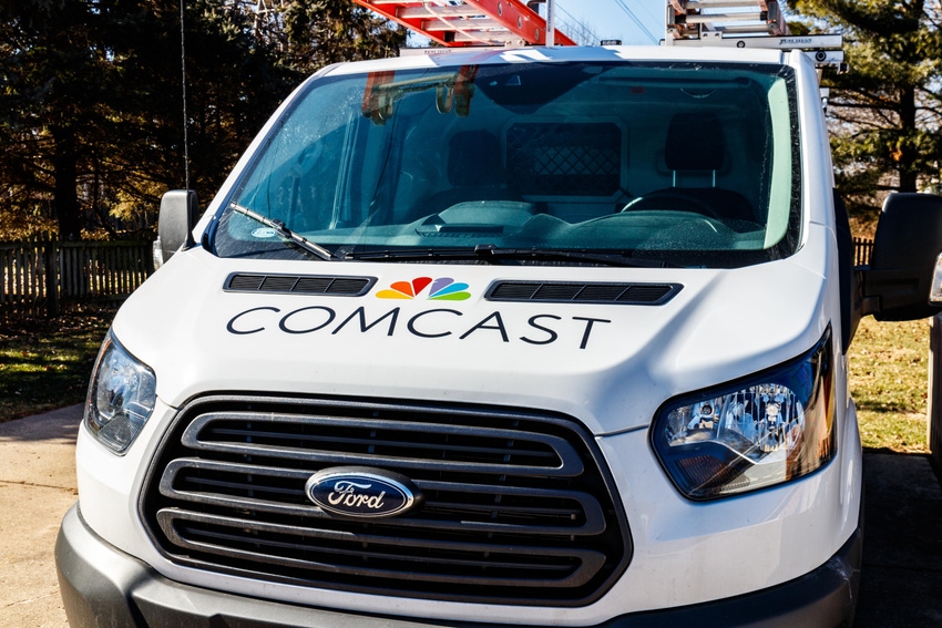 Comcast truck wtih Comcast logo on hood