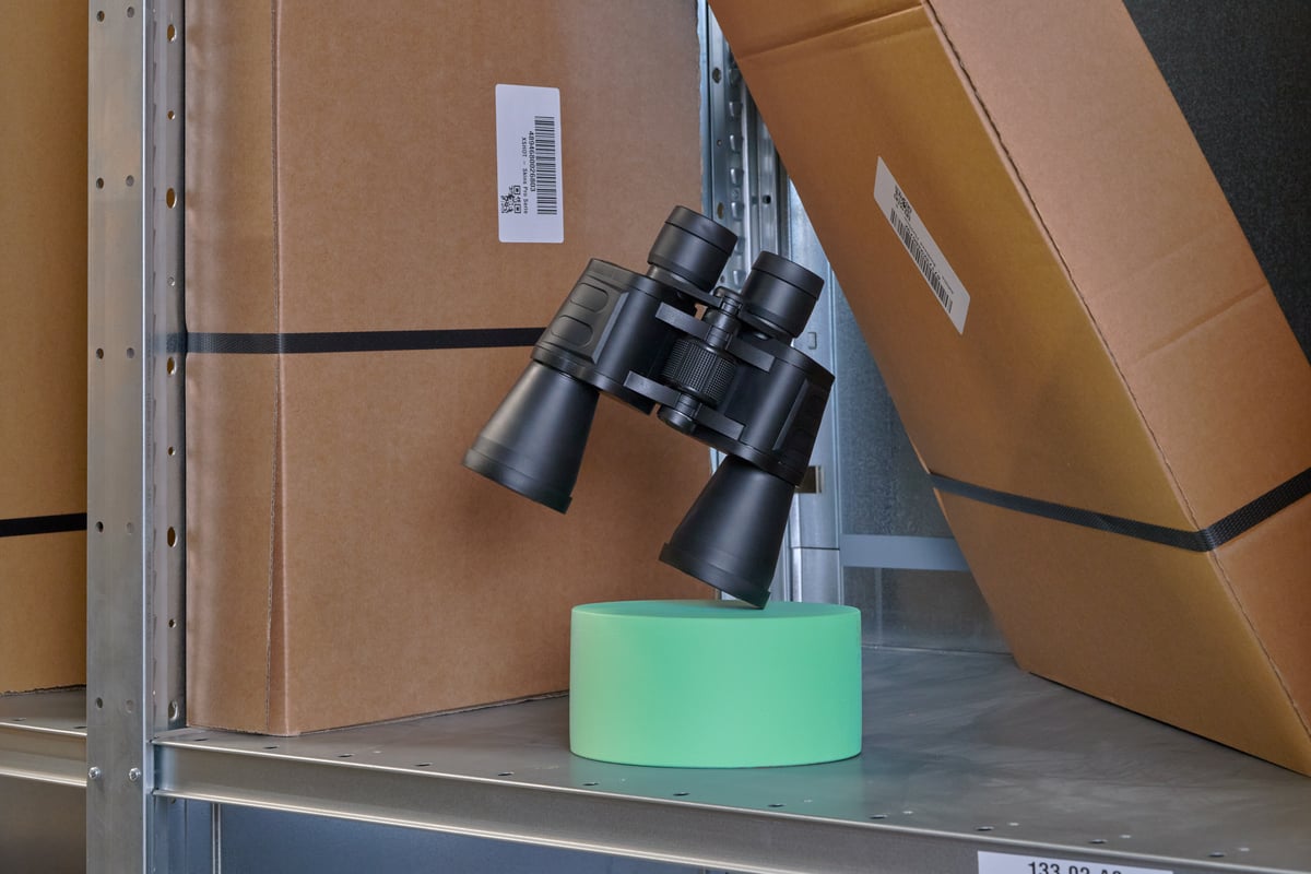 Binoculars between boxes
