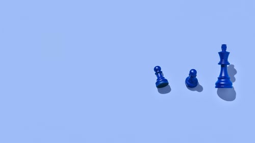 Blue chess pieces on a blue background