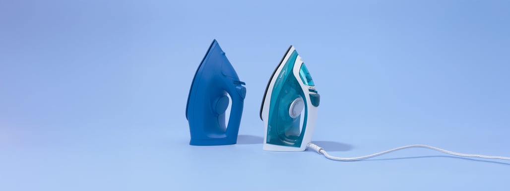 two blue irons with a price sticker on a blue background