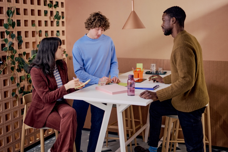 people around a table in an office space