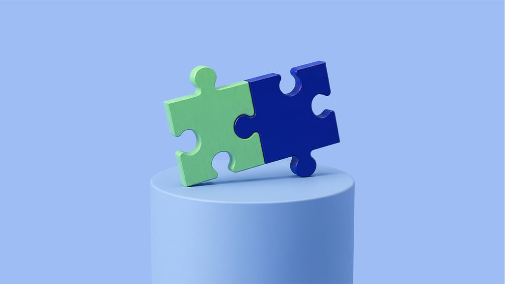 Green puzzle piece fits into blue puzzle piece
