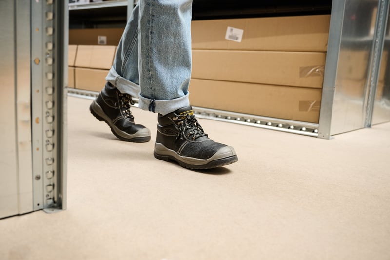 Someone walking in a warehouse.