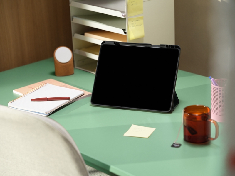 Tablet on green desk