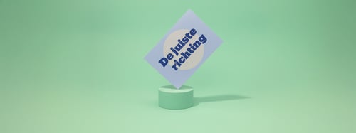 Green background with a blue card visible on it with the text 'the right direction'
