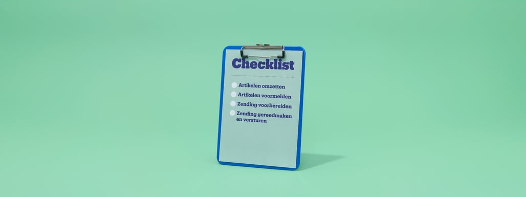 Blue checklist with white paper on a green background