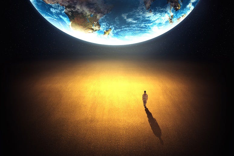 Man looking up at the planet Man looking up at the planet